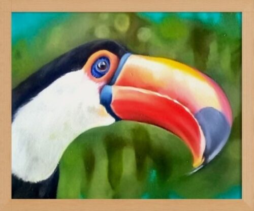 Bright portrait of a toco toucan, large hooked beak in orange, yellow, pink and blue tones. Forest background. Framed painting.